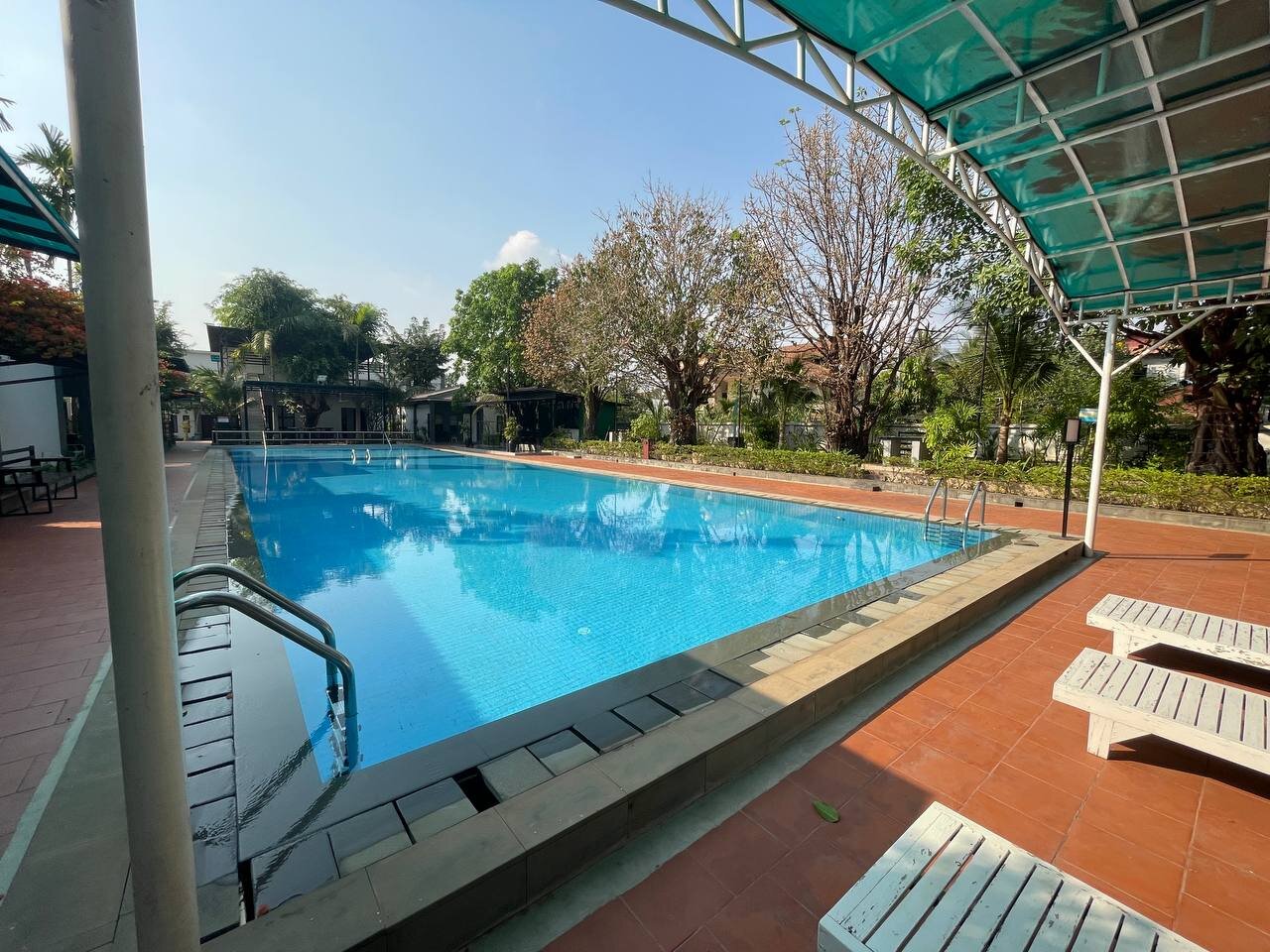 Poolside shade canopy and deck at Bungalow 1955, Siem Reap